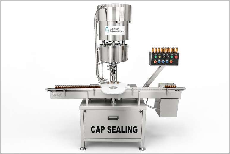 Industrial cap-sealing machine with stainless steel housing and operator console, labeled CAP SEALING.