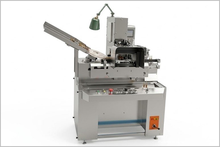 Automated metalworking machine with a circular work holder, inclined feed chute, and control panel.