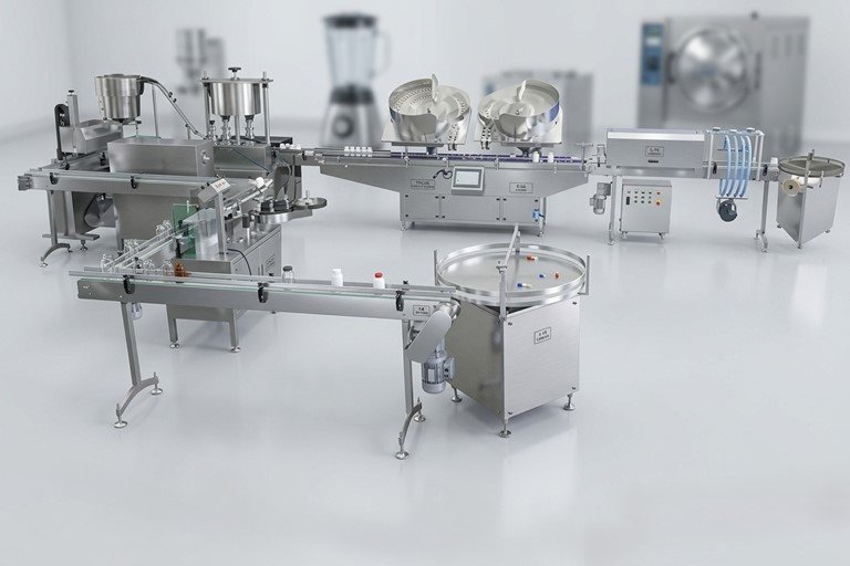 Sterile pharmaceutical production line with stainless conveyors, rotating mixing bowls, and a control panel in a cleanroom environment.