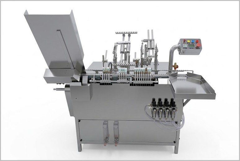 Industrial stainless steel filling machine with a left-side hopper and a control panel on the right, showing multiple valves and piping pieces for packaging operations.