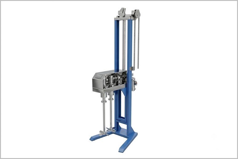 Vertical hydraulic material testing machine with a blue frame, dual columns, chain-driven actuator, and a side control console.
