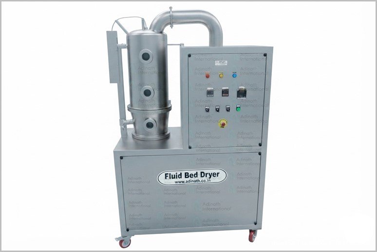 Industrial fluid bed dryer on a wheeled cart with a control panel and metal piping.