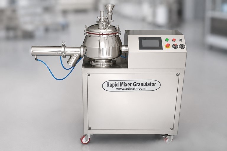 Rapid Mixer Granulator with stainless steel chamber and touchscreen control panel on the right, in an industrial setting.