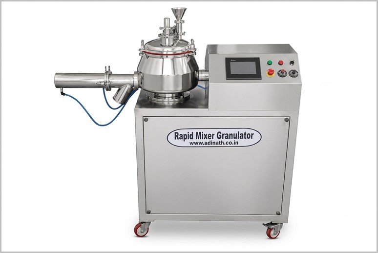 Industrial stainless-steel rapid mixer granulator on a wheeled cart with a control panel on the right and label visible on the front panel to indicate its function, for pharmaceutical use.