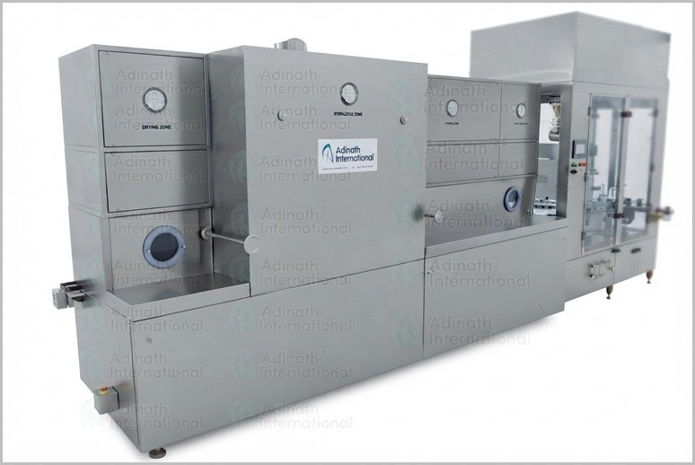 Large stainless-steel industrial processing machine with multiple connected sections and a control panel on the right side, used for high-volume manufacturing or packaging.
