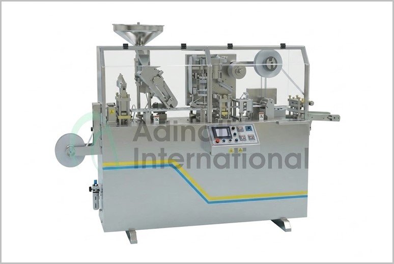 Industrial packaging machine with a transparent safety cover and a control panel on the front.